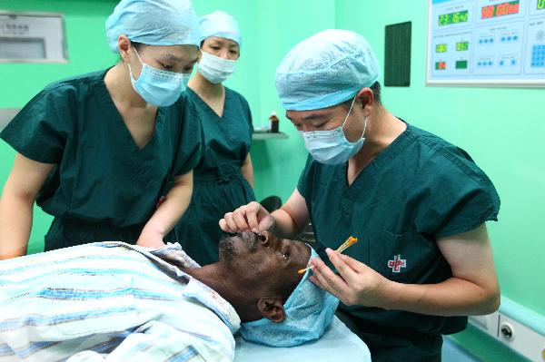 Chinese medical workers prepares to perform a cataract surgery for a 53-year-old Djibouti man aboard the Chinese navy hospital ship 'Peace Ark' in Djibouti Sept. 25, 2010. 