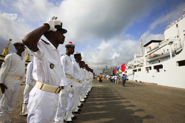 Djibouti navy soldiers salute in front of China's hospital ship Peace Ark at the port of Djibouti, Sept. 29, 2010.