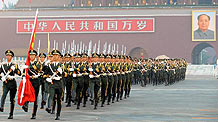 Guards of the national flag march during the flag-raising ceremony at Tian'anmen Square in central Beijing, capital of China, Oct. 1, 2010, the 61th anniversary of the founding of the People's Republic of China.