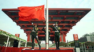 The national flag of the People's Republic of China is raised in front of China Pavilion to mark the National Pavilion Day for China at the World Expo Park in Shanghai, east China, Oct. 1, 2010, which is also the 61st anniversary of the founding of the People's Republic of China.