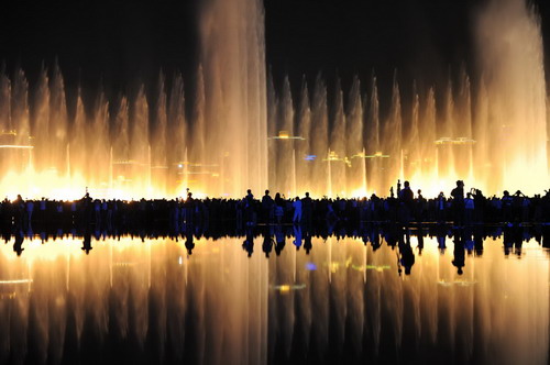 Music fountains are illuminated by colorful laser lights at the Shanghai World Expo to celebrate the National Day on Oct 1st, 2010.