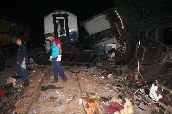 Rescuers work at the site of a train crash accident in Petarukan of Indonesia's Central Java Oct. 2, 2010.