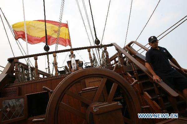 A crew member walks downstairs on board the Spanish galleon replica Andalucia docked on Pier 13 in Manila, the Philippines, Oct. 6, 2010. 