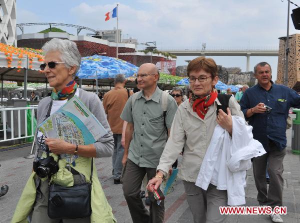 Tourists visit the World Expo Park in Shanghai, east China, Oct. 7, 2010. 