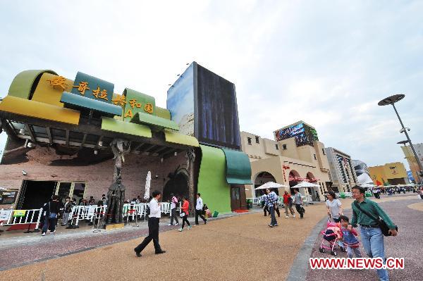Tourists walk outside the Angola Pavilion in the World Expo Park in Shanghai, east China, Oct. 7, 2010. 