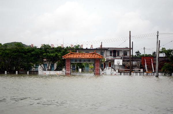 Photo taken on Oct. 7, 2010 shows a submerged primary school in Wancheng Township of Wanning, south China's Hainan Province. Heavy rainfall in Wanning since Sept. 30 has afflicted 357,700 residents.