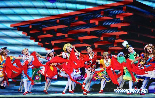 Children perform dancing during the opening ceremony of the Shanghai Week of the 2010 World Expo in Shanghai, east China, Oct. 8, 2010. The five-day Shanghai Week of the 2010 World Expo kicked off on Friday.