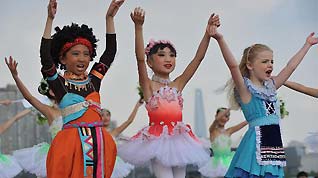 Children perform dancing during the Shanghai Week of the 2010 World Expo in Shanghai, east China, Oct. 8, 2010.
