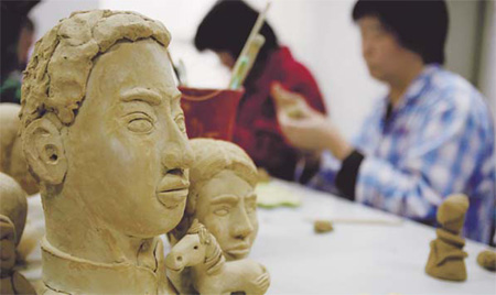Clay sculpture work is used by a hospital in Huilongguan, Beijing, as a means of therapy for patients suffering from mental problems, on March 29.