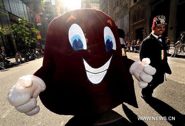 A cartoon model attends the parade along the 5th Avenue in Manhattan, New York, the United States, Oct. 11, 2010 to celebrate the annual Columbus Day. 