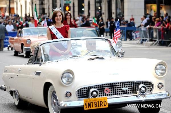 Parading cars run along the 5th Avenue in Manhattan, New York, the United States, Oct. 11, 2010 to celebrate the annual Columbus Day. 
