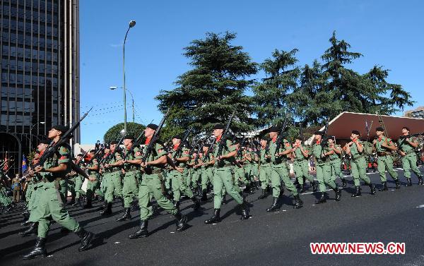 Soldiers of Spanish armed forces take part in a military parade during Spain's National Day in Madrid, Spain, on Oct. 12, 2010.