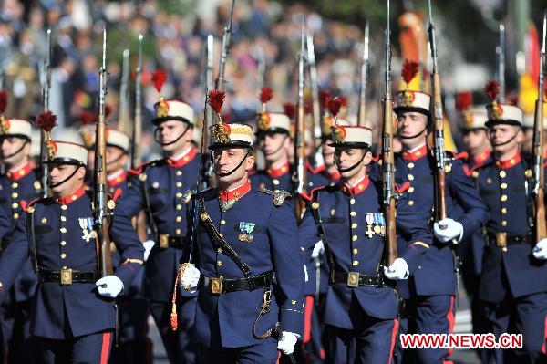 Soldiers of Spanish armed forces take part in a military parade during Spain's National Day in Madrid, Spain, on Oct. 12, 2010.