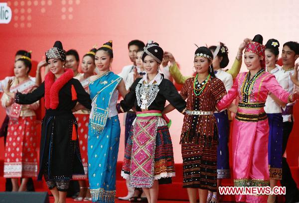 People perform for the National Pavilion Day for the Lao People's Democratic Republic in World Expo Park in east China's Shanghai on Oct. 12, 2010.