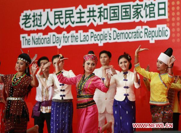 People perform for the National Pavilion Day for the Lao People's Democratic Republic in World Expo Park in east China's Shanghai on Oct. 12, 2010.