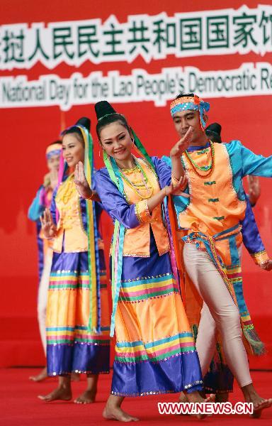 People perform for the National Pavilion Day for the Lao People's Democratic Republic in World Expo Park in east China's Shanghai on Oct. 12, 2010. 