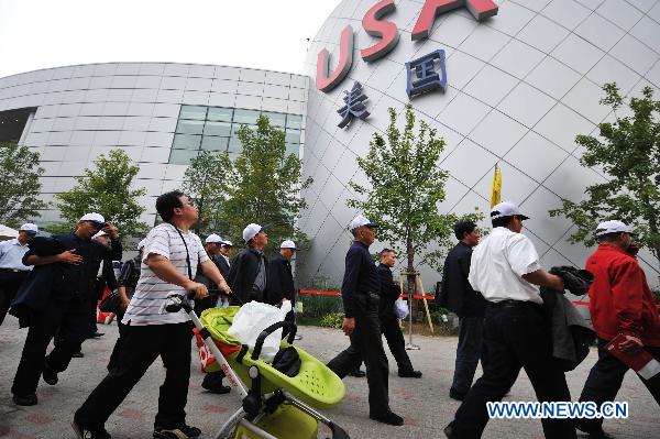 Visitors are seen around America pavilion in World Expo Park in east China's Shanghai on Oct. 12, 2010. 
