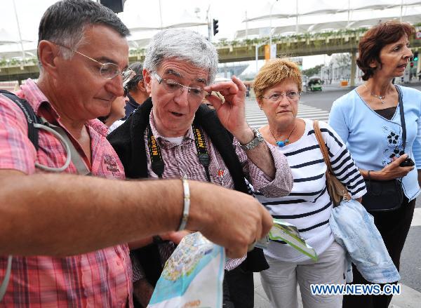 Visitors are seen in World Expo Park in east China's Shanghai on Oct. 12, 2010. The number of visitors to the World Expo is over 62 million thanks to the pleasant weather in Autumn. 