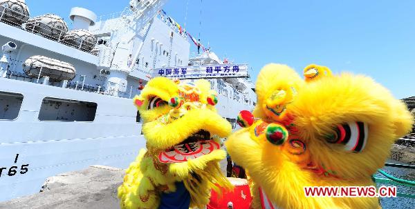 A lion dance performance is held to welcome the Chinese navy hospital ship Peace Ark in Mombasa, Kenya, on Oct. 13, 2010.