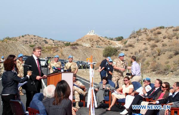 The European Union Enlargement Commissioner Stefan Fule speaks at the opening ceremony for the Limnitis/Yesilirmak crossing, the 7th along the 180-km-long UN-controlled buffer zone in Cyprus, Oct. 14, 2010. 