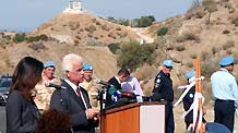 Turkish Cypriot leader Dervis Eroglu speaks at the opening ceremony for the Limnitis/Yesilirmak crossing, the 7th along the 180-km-long UN-controlled buffer zone in Cyprus, Oct. 14, 2010.