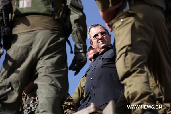 Israeli Defense Minister Ehud Barak is seen surrounded by Israeli Defence Force (IDF) officers during his inspection tour to the Nafah army base in northern Israel, Oct. 13, 2010. [Xinhua/JINI]