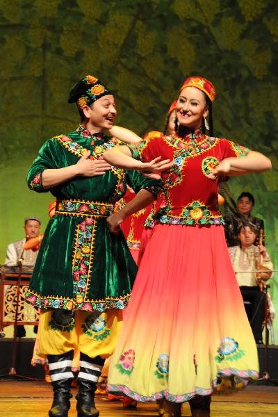 Chinese actors and actresses perform Chinese Uygur-style dance during a large-scale Chinese cultural event termed 'Experience China in Turkey' in Ankara, capital of Turkey, Oct. 17, 2010.