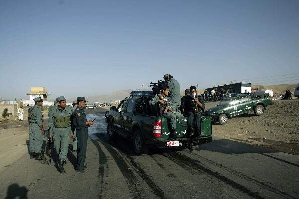 Police secure the site of a blast in Herat, western Afghanistan, on Oct. 18, 2010. 