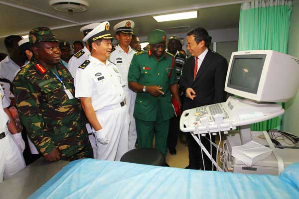 Tanzanian officials inspect medical equipment aboard the Chinese navy hospital ship Peace Ark, Oct 19, 2010.