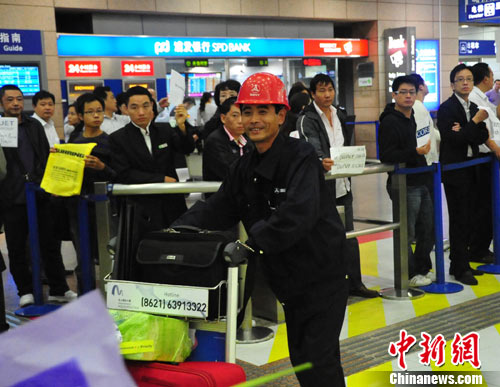 Hao Heng, service manager of China SANY Corporation, arrives at Shanghai Pudong Airport after a 30 hour flight from Chile on Oct. 19th, 2010. 