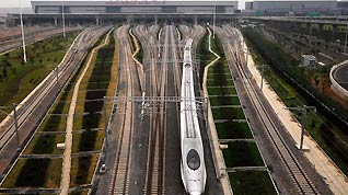 A CRH380A train departs from Shanghai Hongqiao Railway Station on Oct.20th, 2010. The Shanghai Hongqiao Railway Station, along with Shanghai-Hangzhou High-Speed Railway, will be open for commercial use at the end of the month.