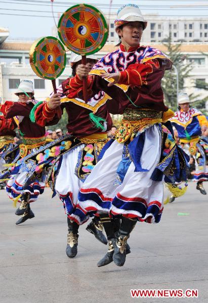 Artists from Tibetan ethnic group dance during an exhibition of the intangible culture heritages of Gansu Province, in Lanzhou, capital of northwest China's Gansu Province, Oct. 22, 2010.