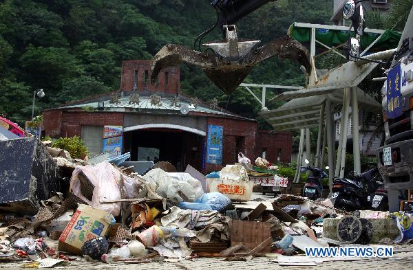 Photo taken on Oct. 24, 2010 shows waste piling up on the streets of Su'ao, southeast China's Taiwan.