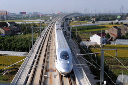 A bullet train runs on the new Shanghai-Hangzhou rail line on Tuesday.