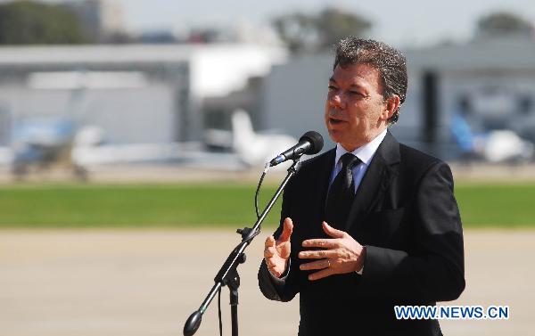 Colombia's President Juan Manuel Santos gives a speech after his arrival to attend the funeral of former President of Argentina Nestor Kirchner, in Buenos Aires, Argentina, Oct. 28, 2010. 