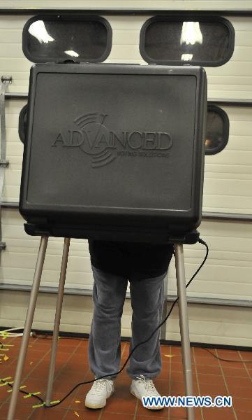 A man casts his vote at a polling station in Arlington, Virginia, the United States, Nov. 2, 2010, the US Midterm Election Day. 
