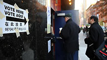 People walk into a polling station in Manhattan of New York, the United States, Nov. 2, 2010, the US Midterm Election Day.