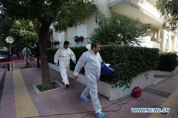 Greek police search for clues outside Swiss embassy in central Athens, Nov. 2, 2010.
