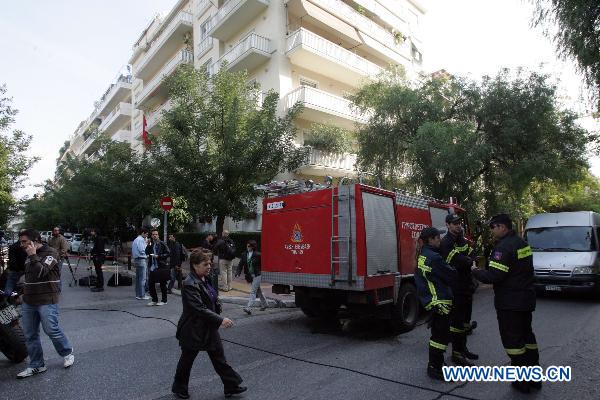 Greek police search for clues outside Swiss embassy in central Athens, Nov. 2, 2010.