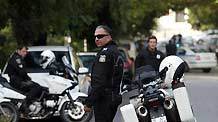 Greek police search for clues outside Swiss embassy in central Athens, Nov. 2, 2010.