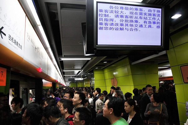 Screens in a Guangzhou subway station direct passengers on Monday.