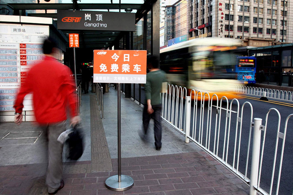 A sign reads &apos;Free Travel Today&apos; at a BRT platform in Guangzhou on Monday.