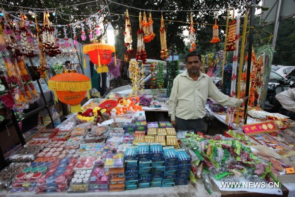 A vendor sells his festive decorations in New Delhi, capital of India, Nov. 2, 2010, prior to the Diwali Festival. Diwali, or festival of lights is the biggest Hindu festival which will be celebrated on Nov. 5 this year. 