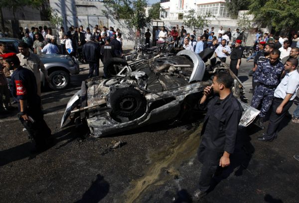 Palestinian security members inspect explosion site in Gaza City, on Nov. 3, 2010. 