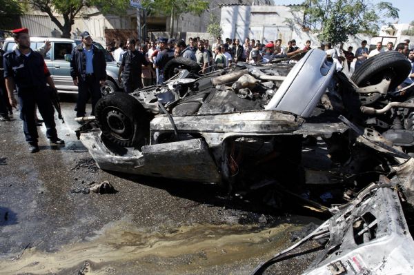 Palestinian security members inspect explosion site in Gaza City, on Nov. 3, 2010. 