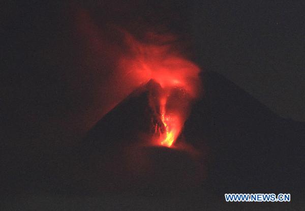 Photo taken on early morning of Nov. 4, 2010 shows Merapi volcano spewing lava and smoke as it erupted again, near the ancient city of Yogyakarta, Indonesia. 