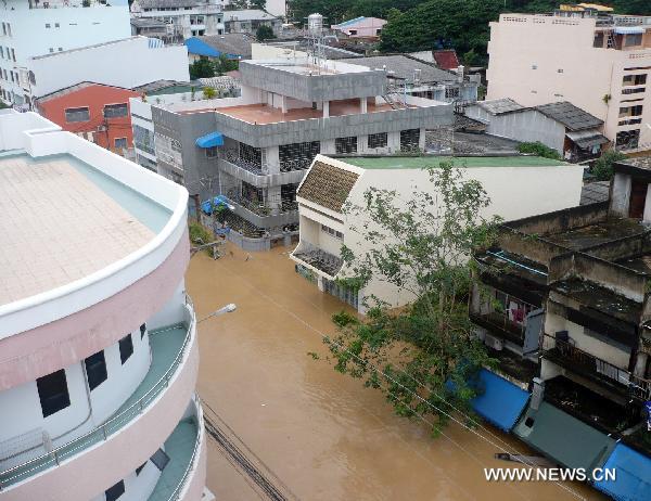 Picture taken on Nov. 2, 2010 shows a flooded street in Hat Yai of south Thailand's Songkhla province. A total of 122 people have been killed by floods in Thailand, the government said Thursday. 