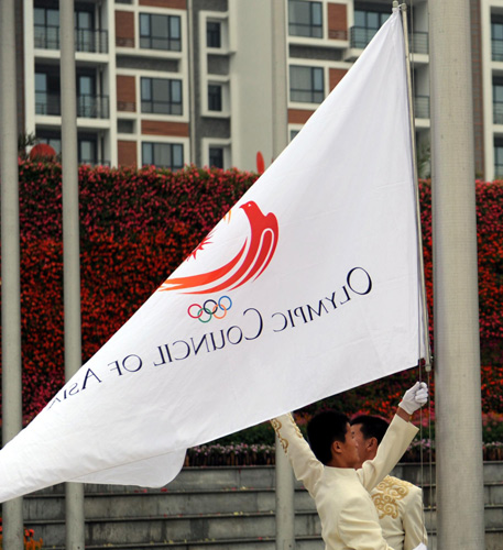 The official flag of the Olympic Council of Asia is raised during the first flag-raising ceremony at Athletes Village for the 16th Asian Games in Guangzhou, Nov 5, 2010.