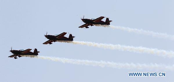 An aerobatic team performs during the AVEX International Air Show at the Sharm El Sheikh airport, Egypt, Nov. 8, 2010.