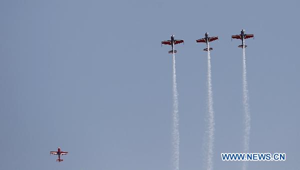 An aerobatic team performs during the AVEX International Air Show at the Sharm El Sheikh airport, Egypt, Nov. 8, 2010.